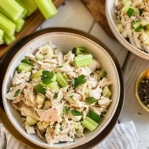 Overhead shot of Chicken Salad Chick copycat recipe served in lettuce cups with crackers and cucumbers.