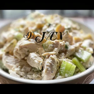 Classic chicken salad served on a croissant and in a bowl.